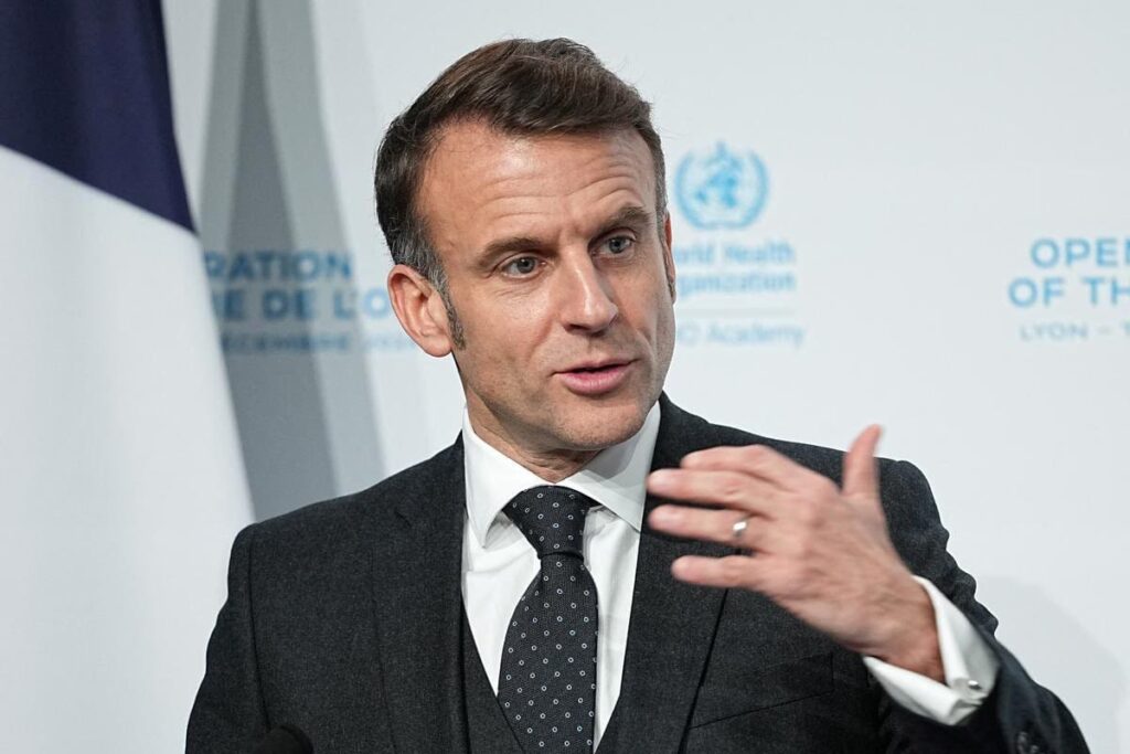 Man in suit speaking at event