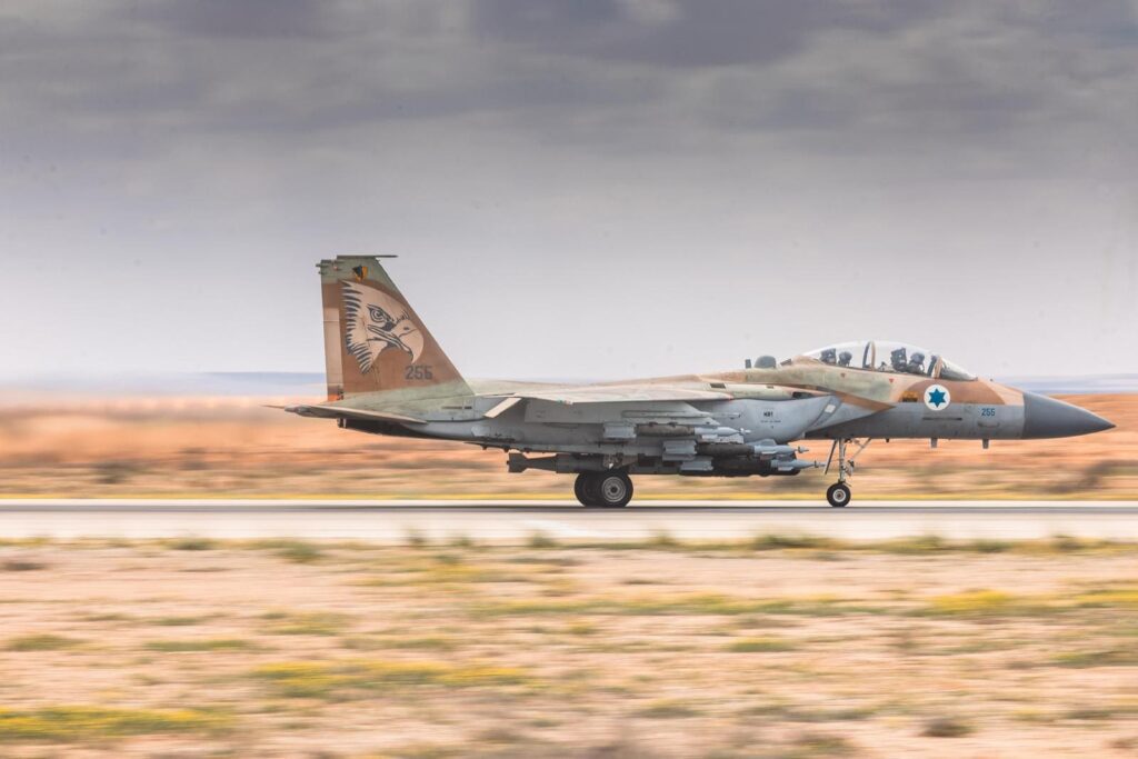 Military fighter jet taking off on runway