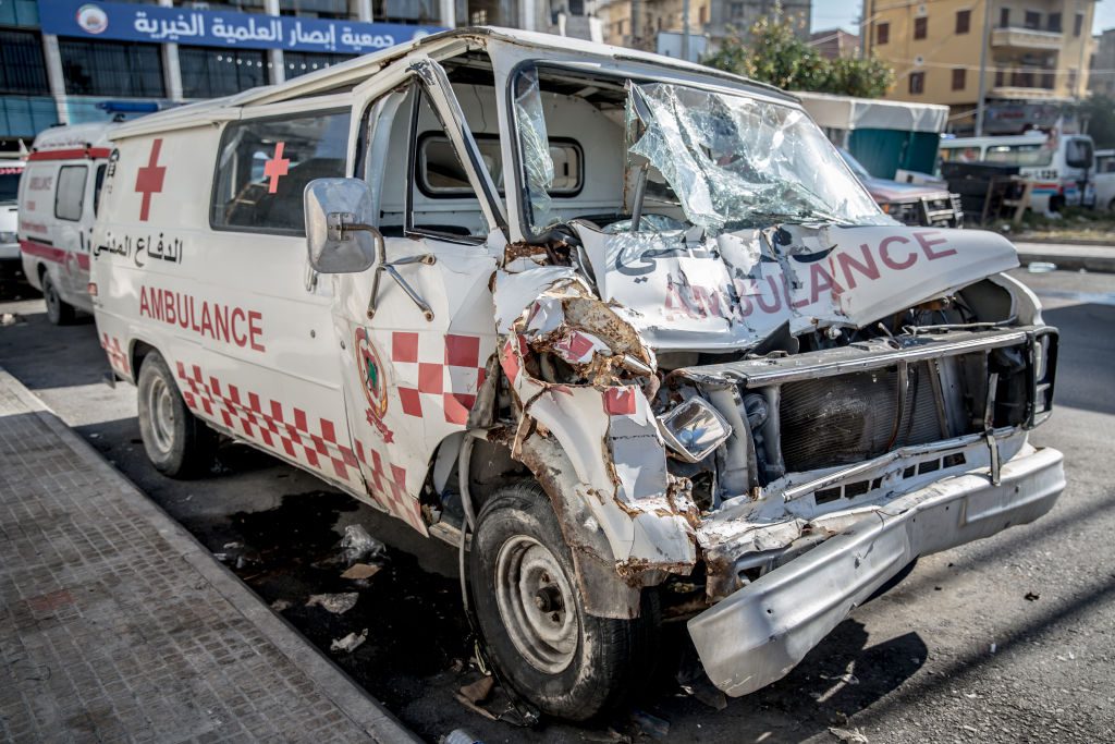 Damaged ambulance vehicle on urban street.