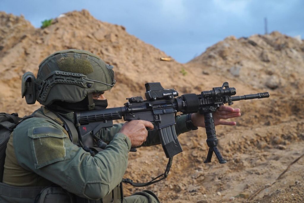 Soldier aiming rifle in training exercise