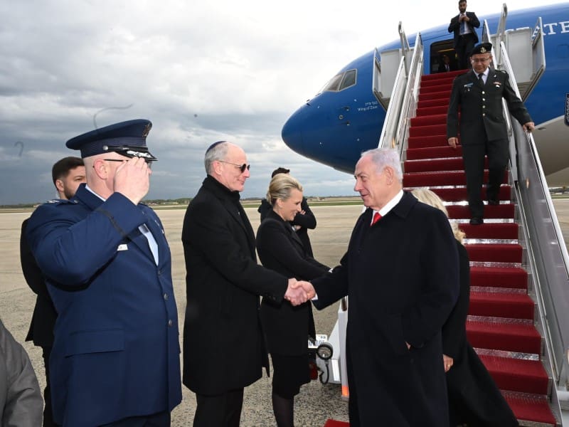 Officials greet visitor at airport red carpet
