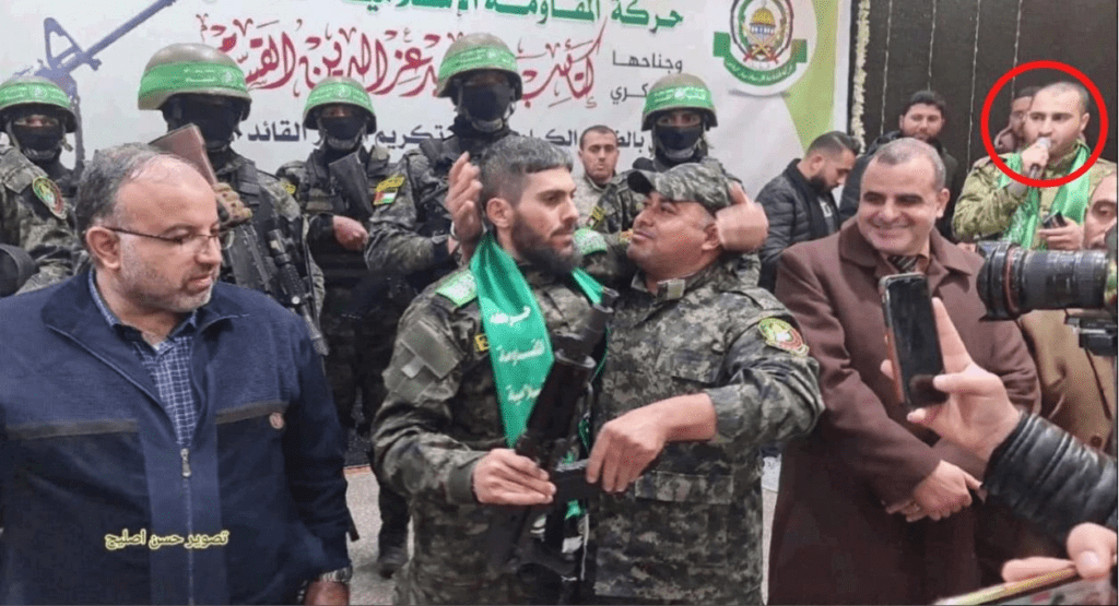 Group of military personnel and civilians in uniform.